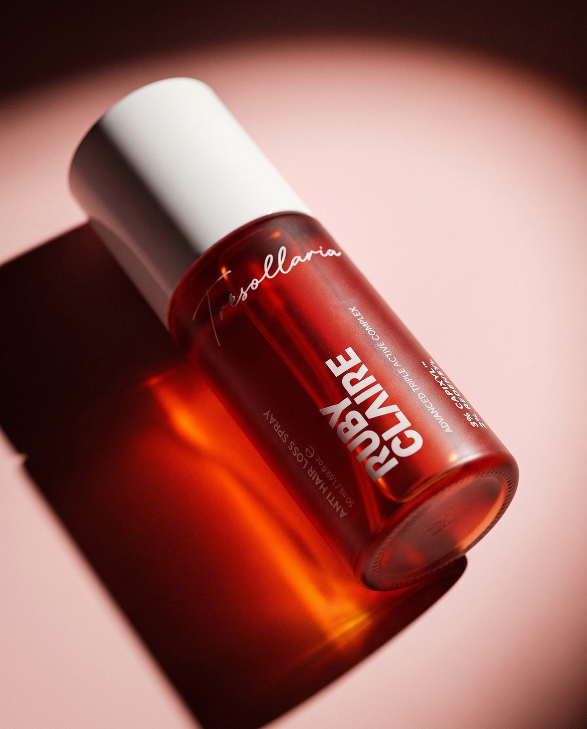 Anti Hair Loss Spray in warm directional light