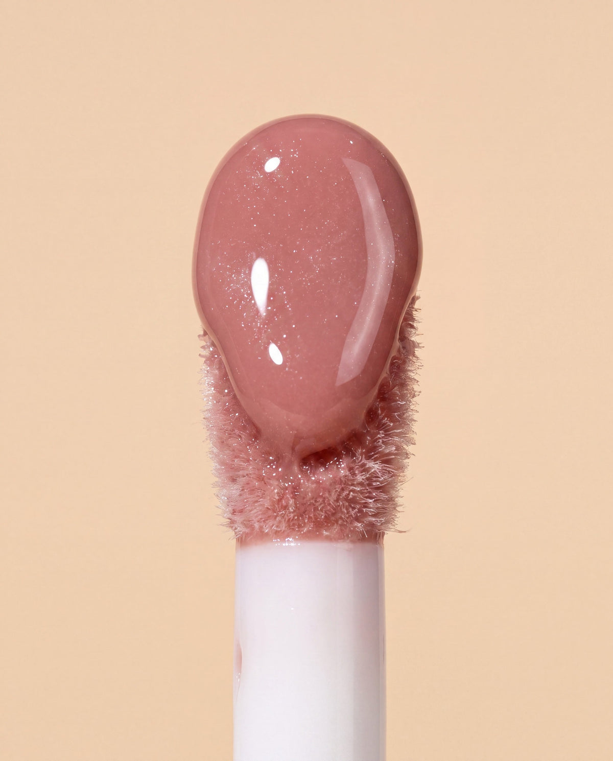 Ruby Claire Dream Lip Oil in Bare Sand — macro applicator