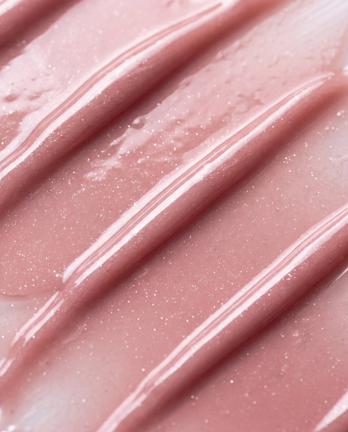 Ruby Claire Dream Lip Oil in Bare Sand — macro texture