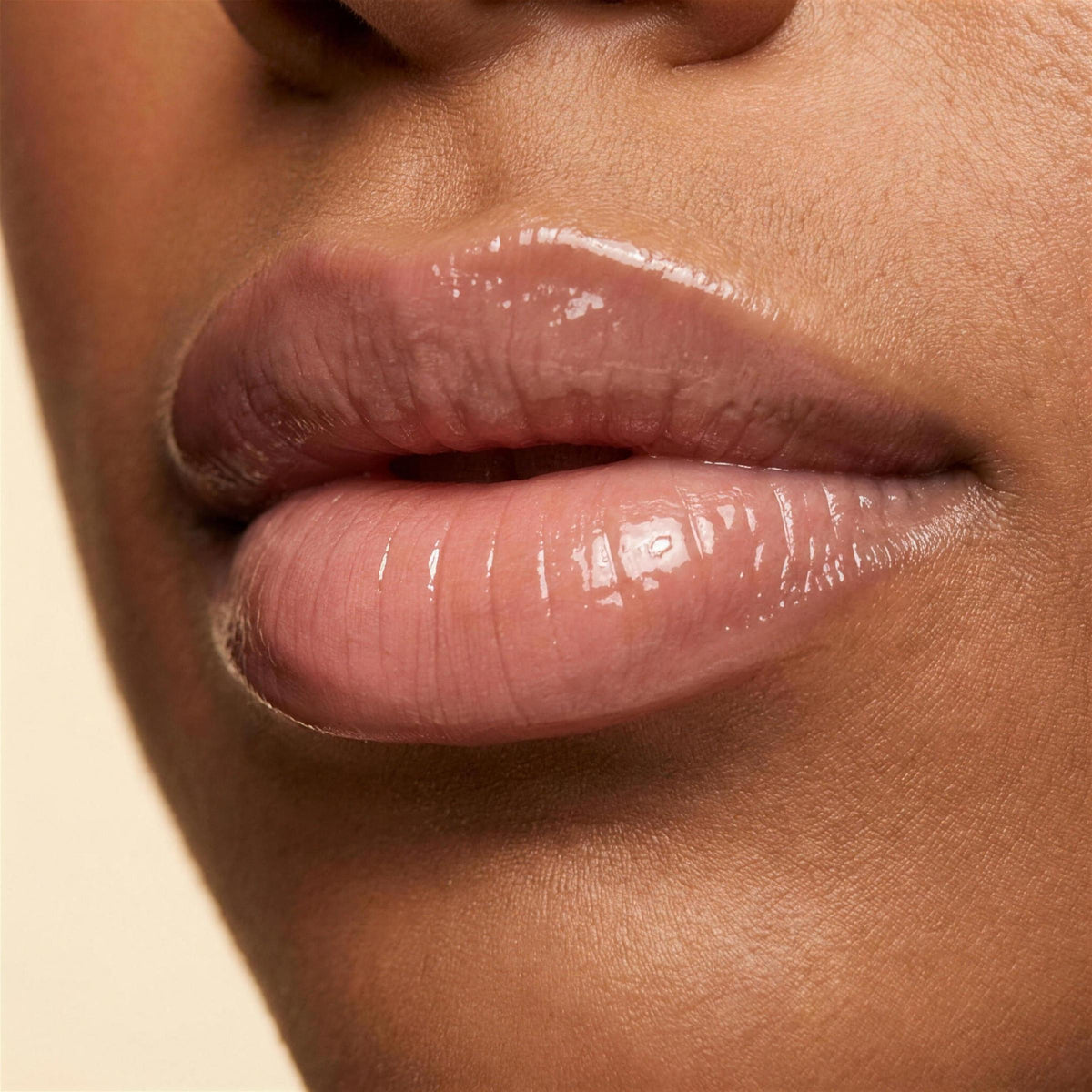 Ruby Claire Dream Lip Oil in Bare Sand — closeup on the lips