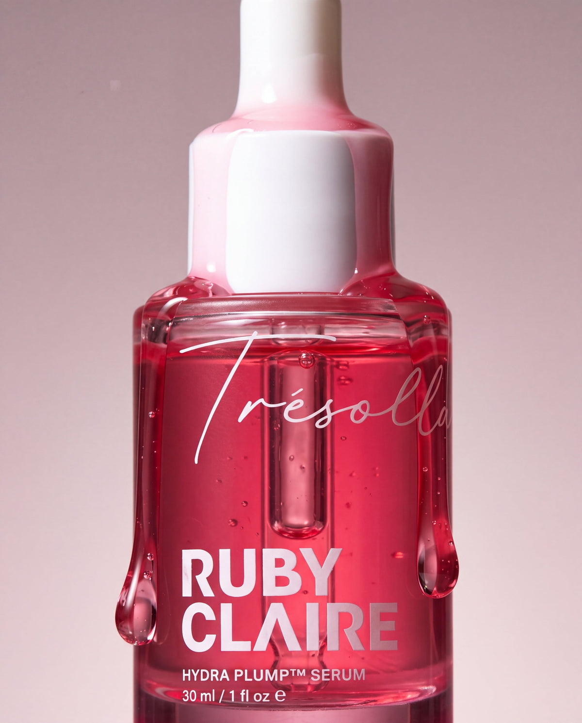 Ruby Claire Hydra Plump Serum bottle with pink serum running over the cap