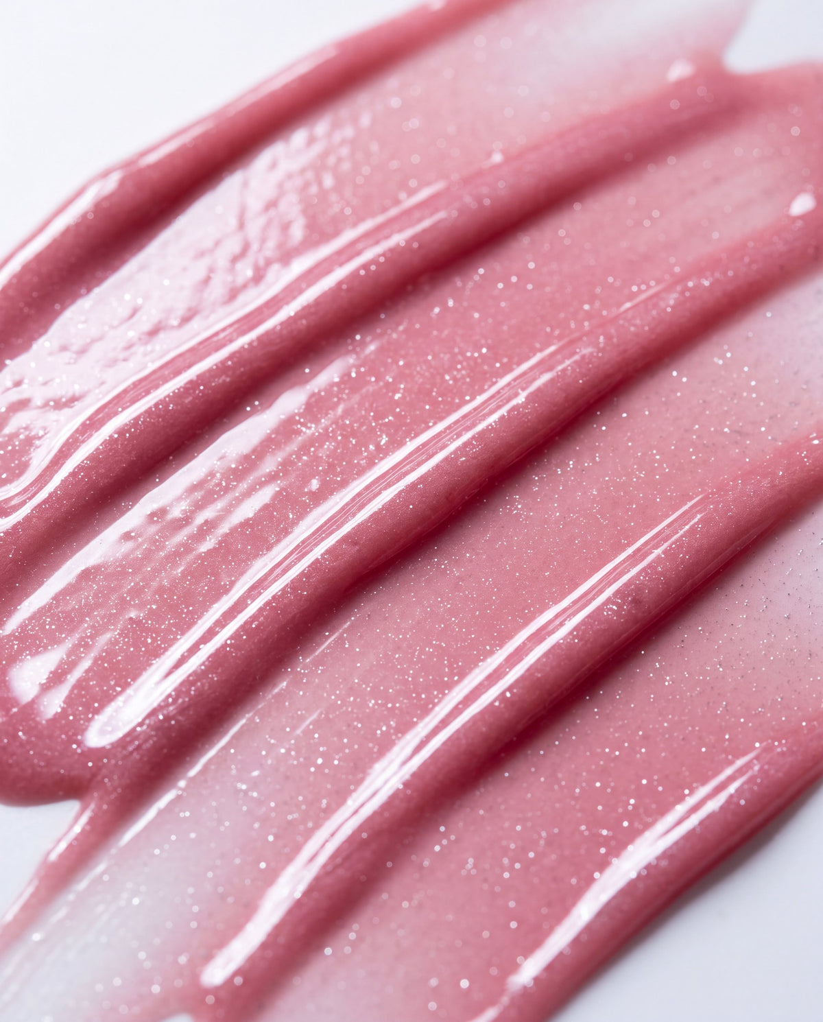 Ruby Claire Dream Lip Oil in Rose Bud — macro texture