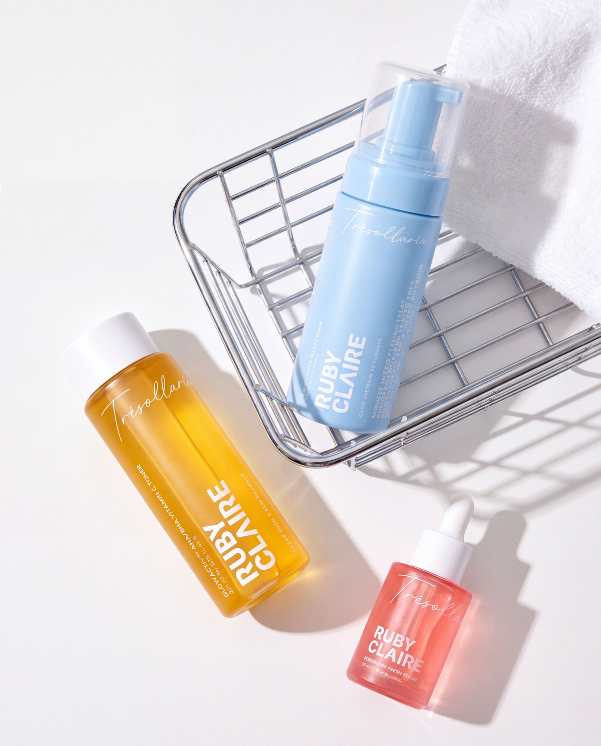Ruby Claire Acne & Clarifying Set flatlay with wire basket and towel