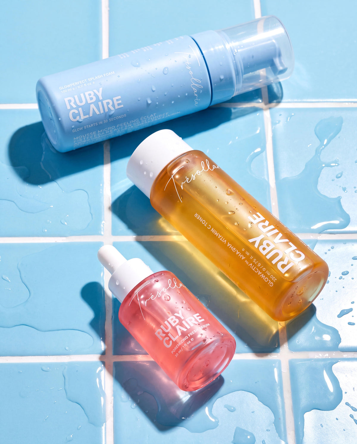 Ruby Claire Acne & Clarifying Set on blue tiles with water droplets