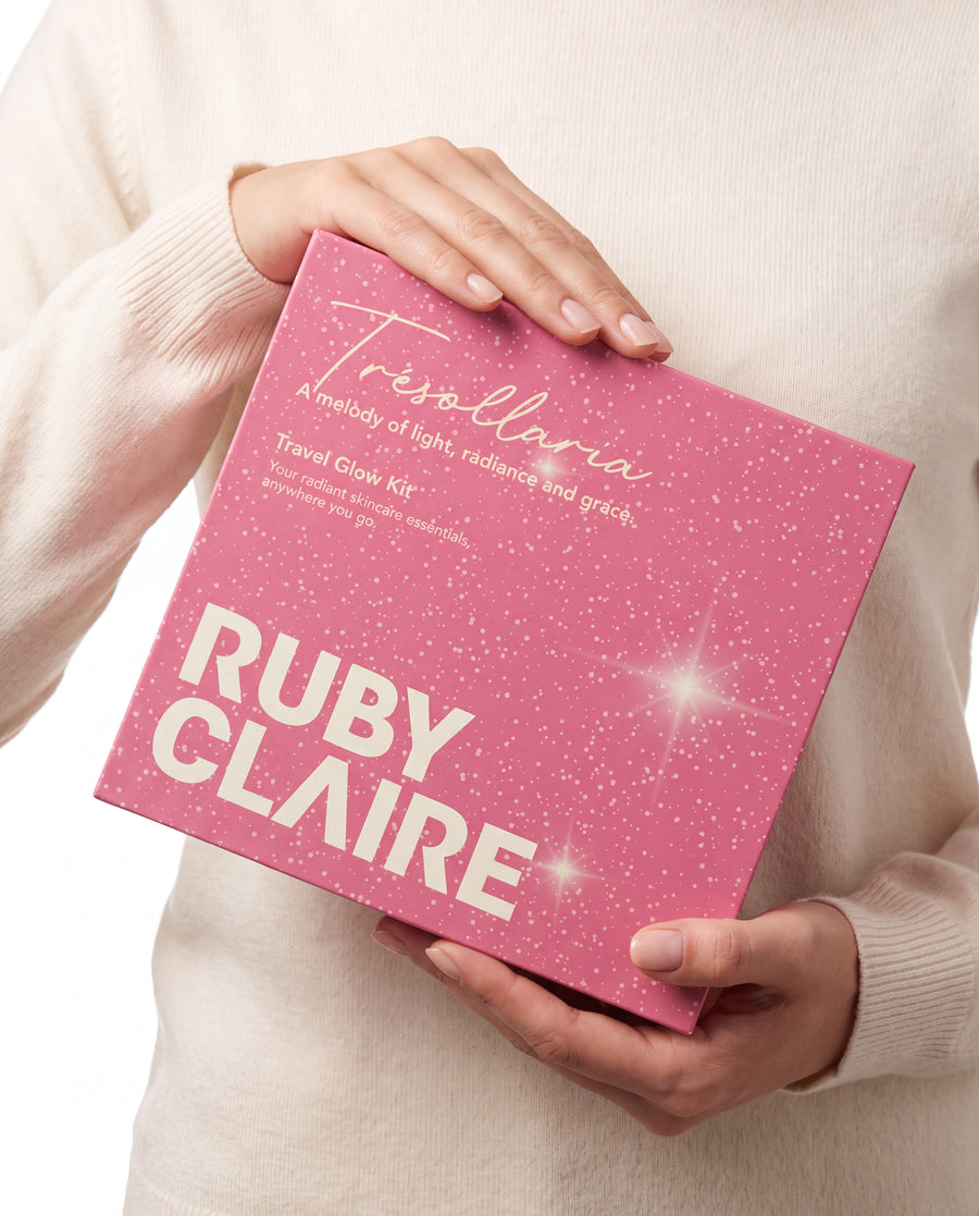 Ruby Claire Glow Box held in hands — Travel Glow Kit gift box