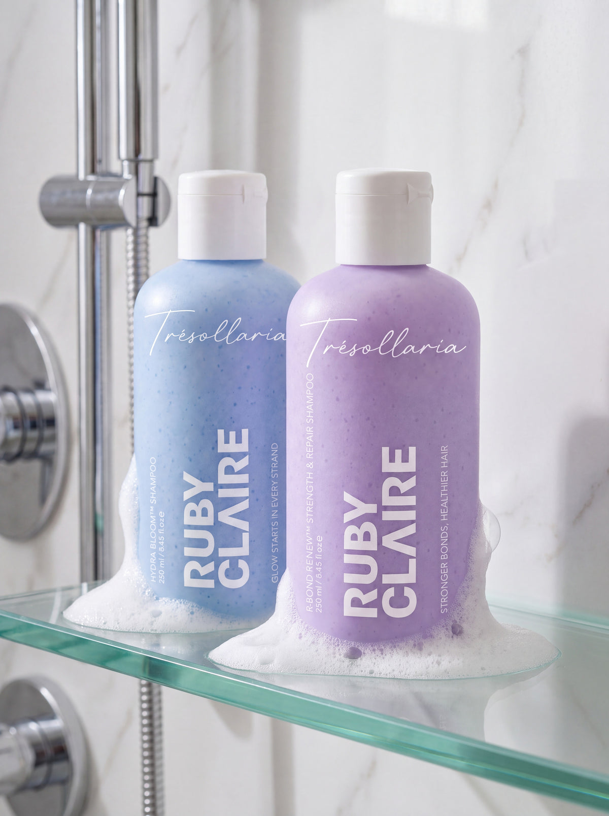 Repair & Strength Set — Hydra Bloom and R-Bond Renew shampoos on a glass shower shelf with foam