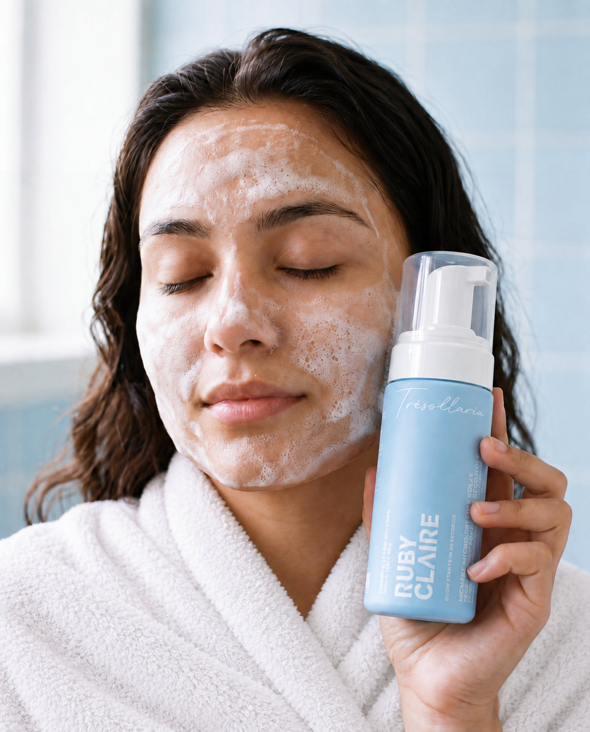 Woman cleansing her face with Ruby Claire GlowPerfect Splash Foam