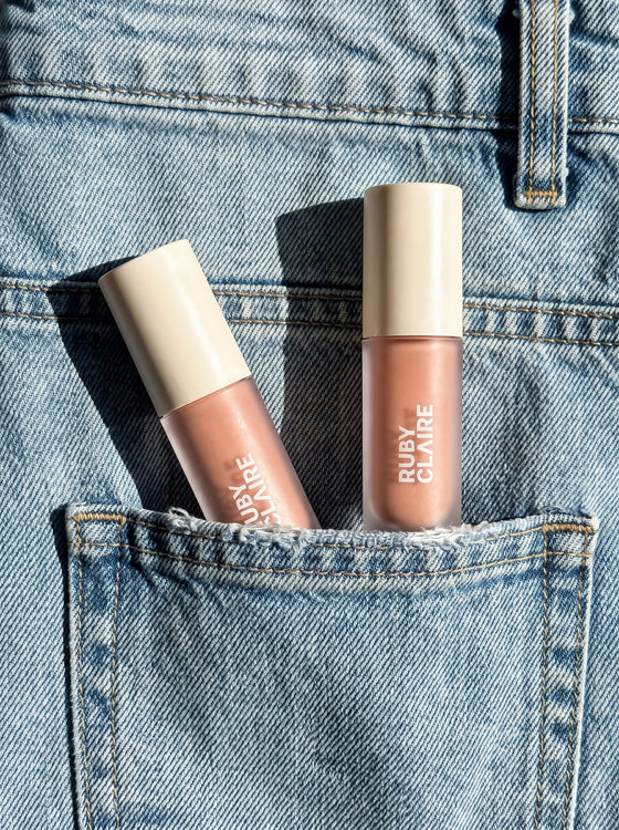 Ruby Claire Dream Lip Oil tucked in a denim back pocket